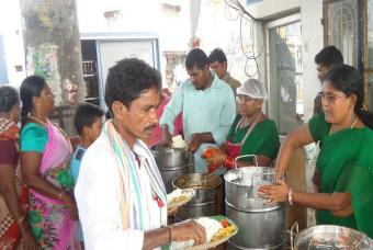 Serving meals to cyclone affected people